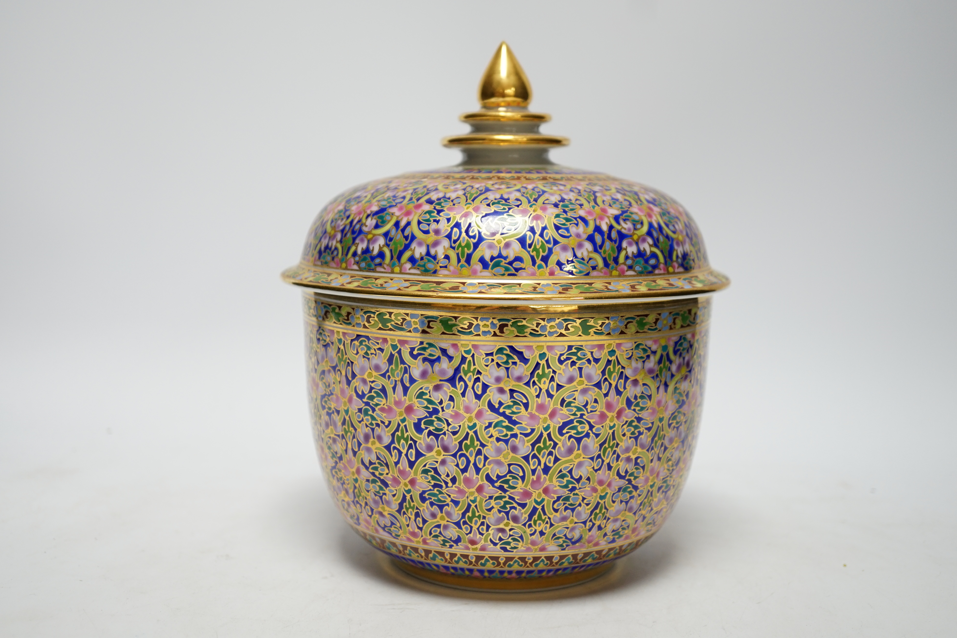 A Continental porcelain bowl and cover enamelled with flowers, 21cm high